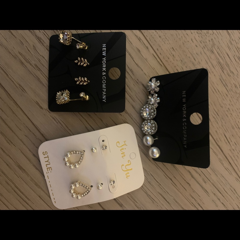 14 pairs of earrings and 4 ring sets